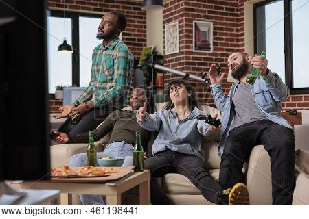 Competitive Group Of People Losing Video Games Play On Tv Console, Feeling Sad And Frustrated About 