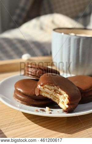 Tasty Choco Pies And Cup Of Hot Drink On Wooden Tray