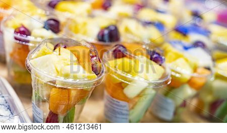 Pre-packaged Fruit Salads Displayed In A Commercial Refrigerator