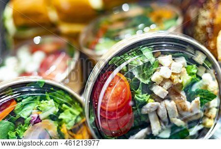 Pre-packaged Ready To Eat Meals Displayed In A Commercial Refrigerator