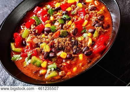 Close-up Of  Taco Soup Of Ground Beef, Tomatoes, Chopped Green Chilis, Onions, Corn, Red Beans And T