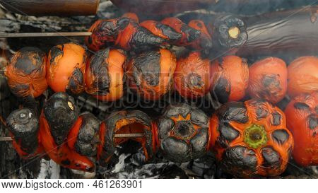 Close-up Of Tomatoes, Peppers And Eggplants Cooked On Charcoal On The Grill. Top View. Delicious And