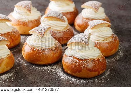 Traditional Swedish Easter Bun Filled With Almond Paste And Whipped Cream Closeup On The Table. Hori