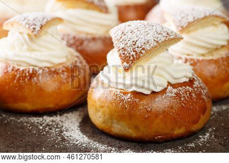 Sweet Buns With Frangipane And Whipped Cream Close-up On The Table. Horizontal