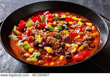 Taco Soup Of Ground Beef, Tomatoes, Chopped Green Chilis, Onions, Corn, Red Beans And Taco Seasoning