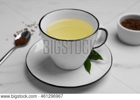 Cup Of Buckwheat Tea On White Marble Table, Closeup