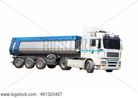 A Large Dump Truck Unloads Rubble Or Gravel At A Construction Site. Car Tonar For Transportation Of 