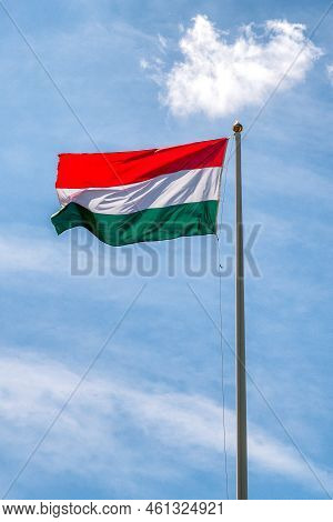 Waving Hungarian Flag On Mast. Hungaria. Eastern Europe