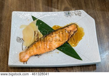 Grilled Salmon On Grill  With Slice Ginger. Fried Salmon Steak. Japanese Salmon Grilled (salmon Shio