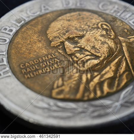 Translation: Republic Of Chile. Coin Of 500 Chilean Pesos Close-up. Peso Of Chile. News About Econom