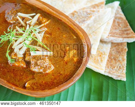 Roti With Northern-style Pork Rib Curry (kaeng Hung Lay). Close-up Photo.