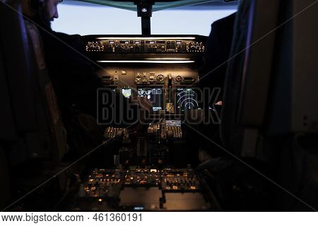 Multiethnic Team Of Captain And Pilot Switching Engine Throttle Lever To Takeoff With Airplane From 