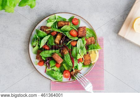 Top View Healthy Salad With Roasted Tempeh, Cherry Tomato, Beetroot Straws, Spinash And Lettuce Leav