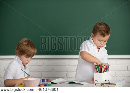 Portrait School Kids Bosy Doing Art Homework, Holding Pencil, Writing. Children Pupils Drawing On El