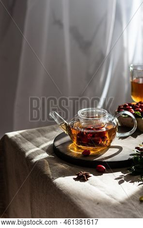 Rosehip Hearbal Tea On Wooden Board. Vertical