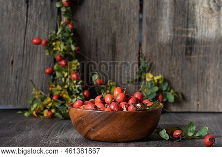 Rosehip Berries On Wooden Rustic Background. Rosehip Branches. Banner