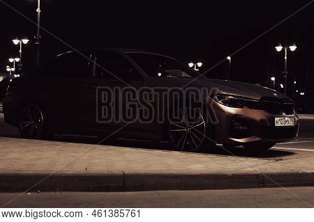 Car Bmw 3 Series G20 Parked On City Parking At Night. Moscow, Russia - September 2022