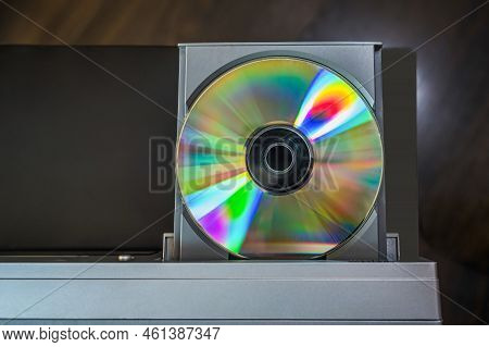 Close-up Vintage Cd Player With Cd. Dvd Inserting To Video Player.