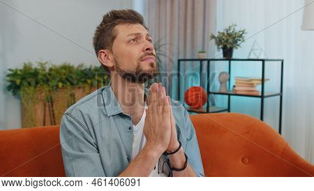 Please, God Help. Man Praying Sincerely With Folded Arms, Looking Upward And Making Wish, Asking Wit