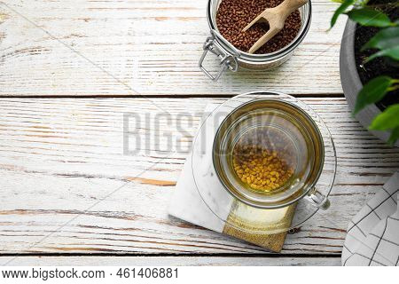 Freshly Made Buckwheat Tea On White Wooden Table, Flat Lay. Space For Text