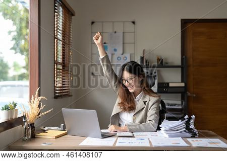 Successful Young Asian Business Woman Achieving Goals Excited Raised Hands Rejoicing With Laptop On 
