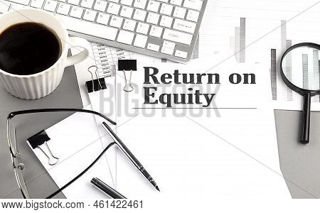 Return On Equity Text On Paper With Magnifier, Coffee And Keyboard On Grey Background