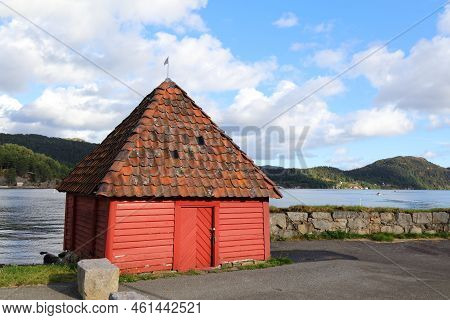 Falun Red Cabin In Gronnes Peninsula In Flekkefjord, Norway.