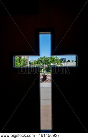 Omaha, Nebraska, Us - 5.2022 - View Out Of A Cross Window Of St. Johns Parish Catholic Church On The