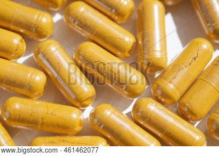 Turmeric Plus Black Pepper Extract Gelatin Capsule Close Up Top View. Herbal Supplement Organic Curc
