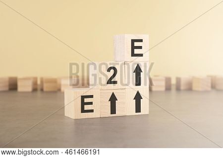 E2e - End To End - An Abbreviation Of Wooden Blocks With Letters On A Gray Background