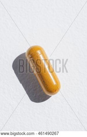 Turmeric Plus Black Pepper Extract Gelatin Capsule Close Up Top View. Herbal Supplement Organic Curc