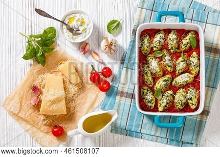 Malfatti, Italian Spinach Ricotta Dumplings  In Tomato Sauce With Herbs And Grated Parmesan Cheese I