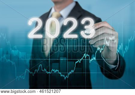 Businessman In Suit Forecast Analysis Plan Profit Chart 2023 Year. Economic Forecasts For 2023. Busi