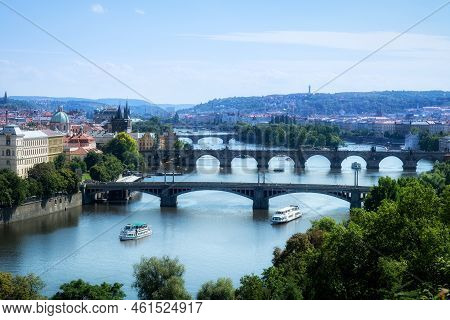 View Of The Bridges On The Vlatva River In The Czech City Of Prague From The Summer Gardens.