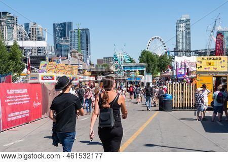 Calgary, Alberta, Canada - July 15, 2022: People Enjoy The Calgary Stampede At The Stampede Park In 