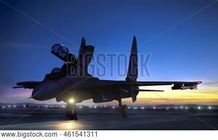 Supersonic Fighter Jet On Air Force Base Airfield Getting Ready To Take Off At Sunset