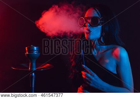 Hookah Atmosphere. The Girl Enjoys Smoking A Hookah, Sheesha. Surrealism