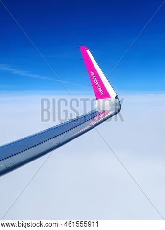 Malmo, Sweden - August 22, 2022: Left Wing Of Wizzair Airplane After Taking Off Above Malmo Sturup A