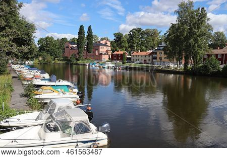 Summer View Of The Waterfront Buildings And Boat Harbour At Askersund In Sweden. Askersund Is A Pict