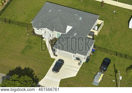 Aerial View Of Typical Contemporary American Private House With Roof Top Covered With Asphalt Shingl