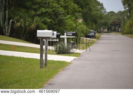 Typical American Outdoors Mail Box On Suburban Street Side.