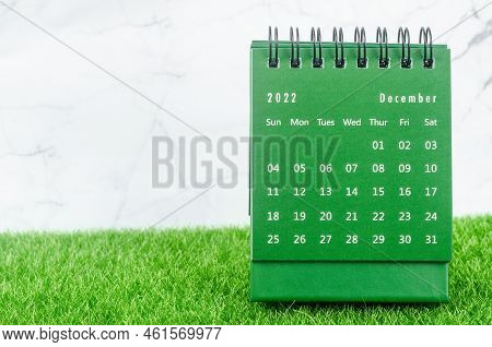 Green December 2022 Monthly Desk Calendar For 2022 Year On Grass.