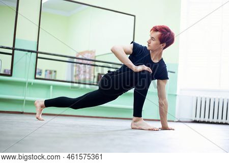Stretching Before Intensive Lesson Of Dancing. Young Male Dancer Preparing For The Lesson In Dancing
