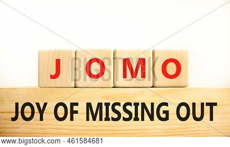 Jomo Joy Of Missing Out Symbol. Concept Words Jomo Joy Of Missing Out On Wooden Blocks On A Beautifu