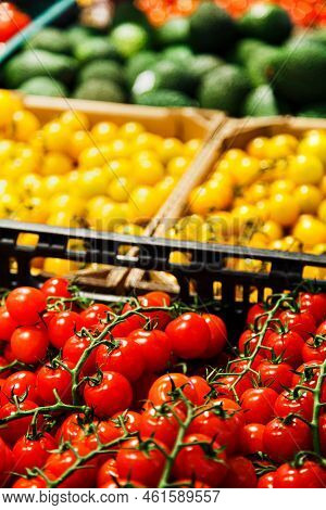 Fresh Colourful Cherry Tomatoes In Boxes At Market.