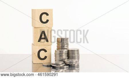 Three Wooden Cubes With Letters Cac, On White Table And Diagram, Business Concept. Cac - Short For C