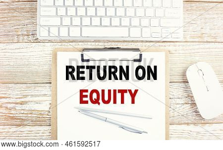 Return On Equity Text On A Notebook On The Graph Background With Pen And Magnifier