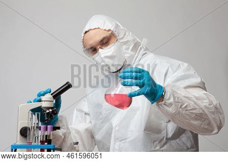 Virologist Examines Monkeypox Fever. Doctor With A Flask. The Study Of The Analyzes Of The Infected.