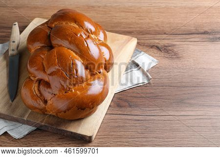 Homemade Braided Bread On Wooden Table, Space For Text. Traditional Shabbat Challah