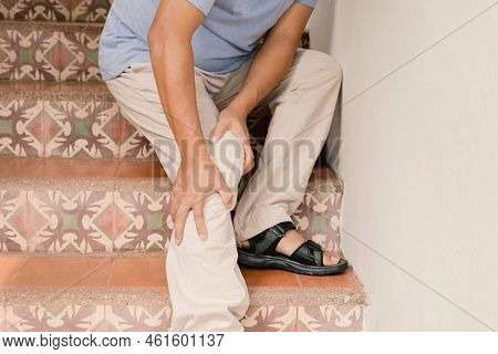 Man Hand Massage Physiotherapy Leg Is Sore And Numb, Exhausted, Tingling. Guillain-barre Syndrome, A